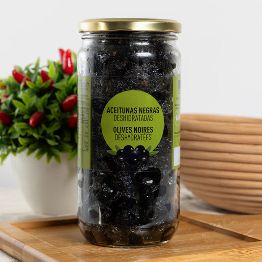 BIO dehydrated black olives in a tall 500 g glass jar, wrinkled matte-black olives with herbs and oil