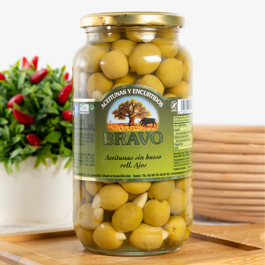 Bravo pitted green olives stuffed with garlic cloves in a 500 g
glass jar, garlic visible in each olive