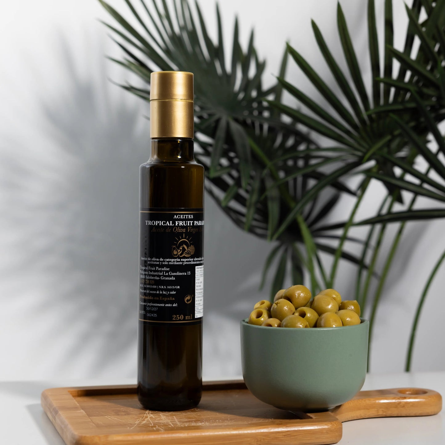 Tropical Fruit Paradise extra virgin olive oil in a 250 ml dark
glass bottle with gold cap, produced in Spain