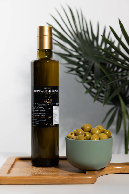Tropical Fruit Paradise extra virgin olive oil in a 500 ml dark
glass bottle with gold cap, produced in Spain